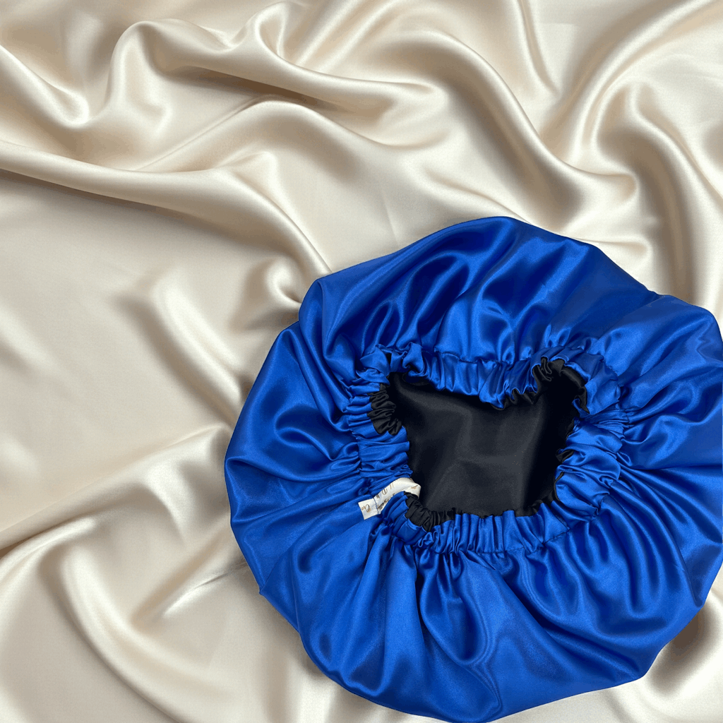 Blue shower cap on a beige satin background